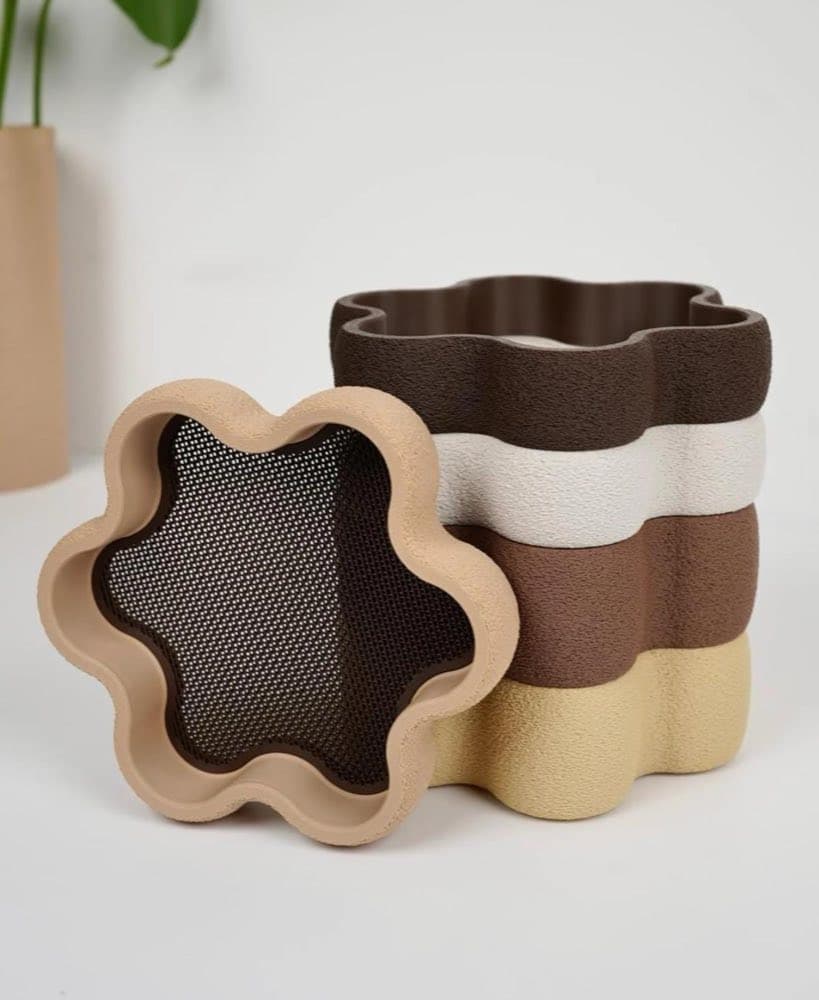 Round stackable jewellery trays holding rings and bracelets