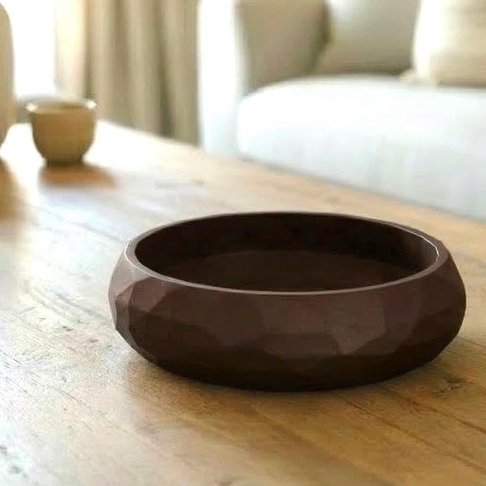 Faceted geometric catch-all bowl with a low-poly shape